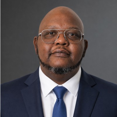 Professional headshot of Adrian Lyons